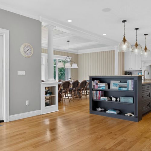 Fully equipped kitchen, dining room, and sliding door leading to deck