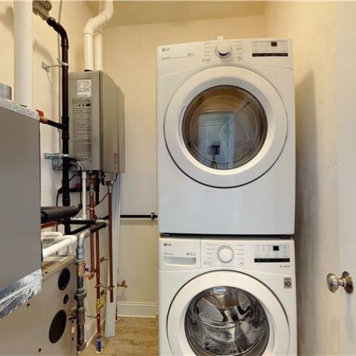 Stacked washer and dryer located in closet