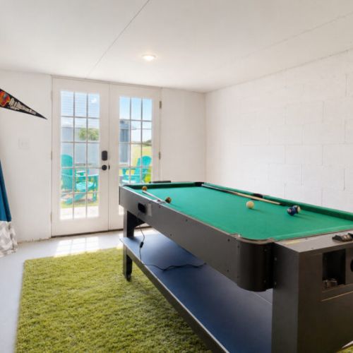 Pool table in basement gameroom
