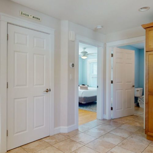 Basement door to laundry| doors to first floor bedroom and bathroom