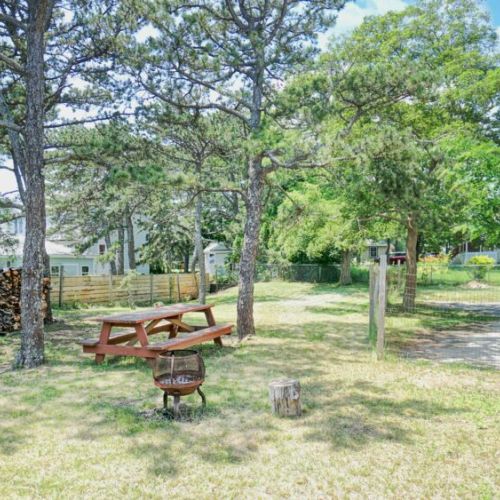 Backyard with firepit and picnic table