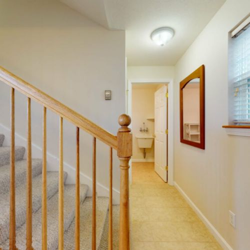 Stairs to second floor | hallway to first floor bathroom