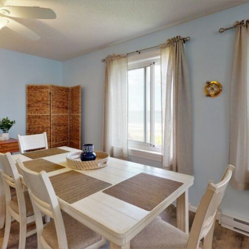 Dining table | table offers additional bench seating | gorgeous beach views while dining