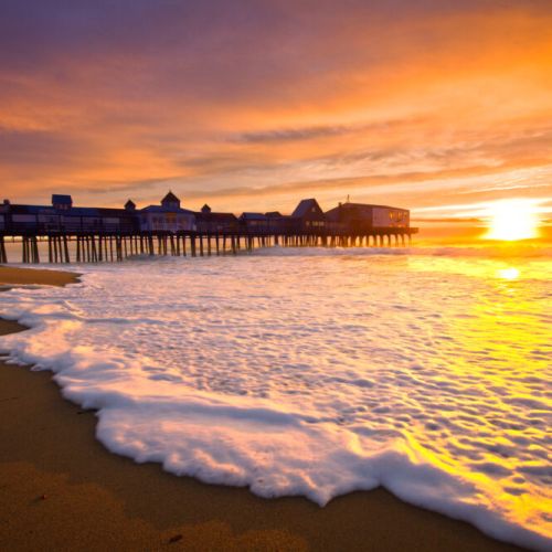 Old orchard beach pier at sunset