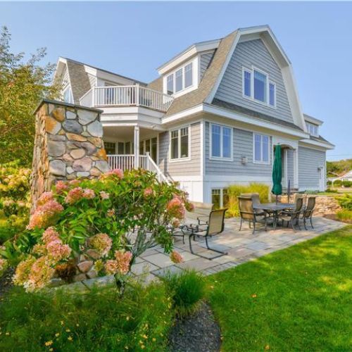 Coastal home in beautiful pine point | patio seating with grill